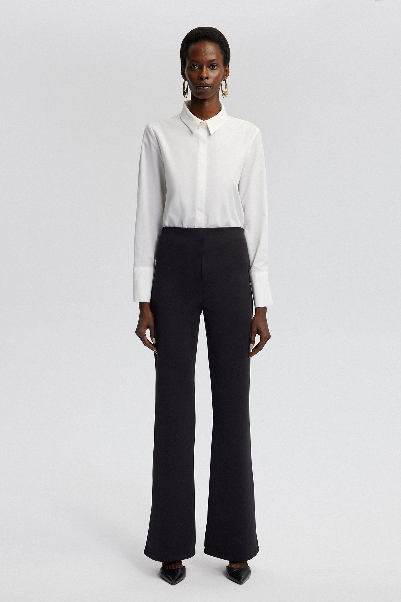 MID-RISE FLARE TROUSERS