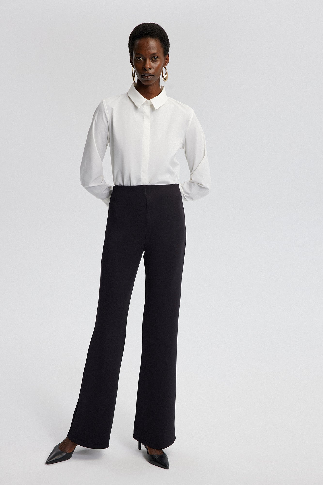 MID-RISE FLARE TROUSERS